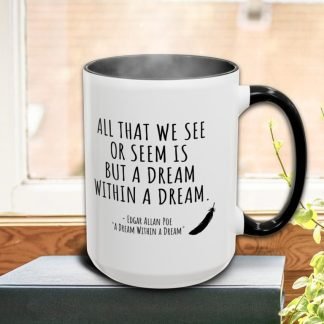 A steaming white mug with a black handle sits on a book by a window. It features a quote by Edgar Allan Poe about dreams, with a feather illustration. Plants nearby add a serene touch.
