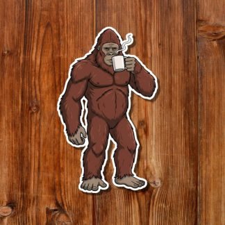 Illustration of a Bigfoot holding a steaming mug and drinking coffee from it, standing on a wooden surface. The Bigfoot has a calm expression, creating a humorous, cozy vibe.