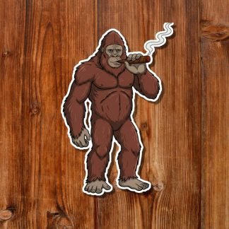 Illustration of a Bigfoot standing on two legs, smoking a cigar with a relaxed expression. The background is a textured wooden surface.