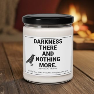 A white candle with a black lid sits on a wooden surface. The label reads "Darkness There and Nothing More" with a raven illustration. In the background, a cozy fireplace emits a warm glow.