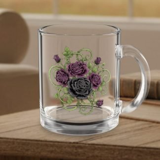 Clear glass mug with intricate goth style purple and black rose design featuring green vines. The mug rests on a wooden table in a cozy living room setting.