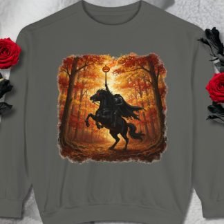 A sweatshirt features a Headless Horseman riding a rearing black horse in a spooky autumn forest with glowing trees. Two red roses are beside the sweatshirt.