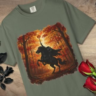 Gray T-shirt with a vivid design of a headless horseman holding a flaming pumpkin in an autumn forest. Surrounding are black and red roses on wood.